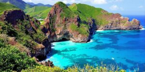 Scenic view of Komodo Island's coastline and blue waters.